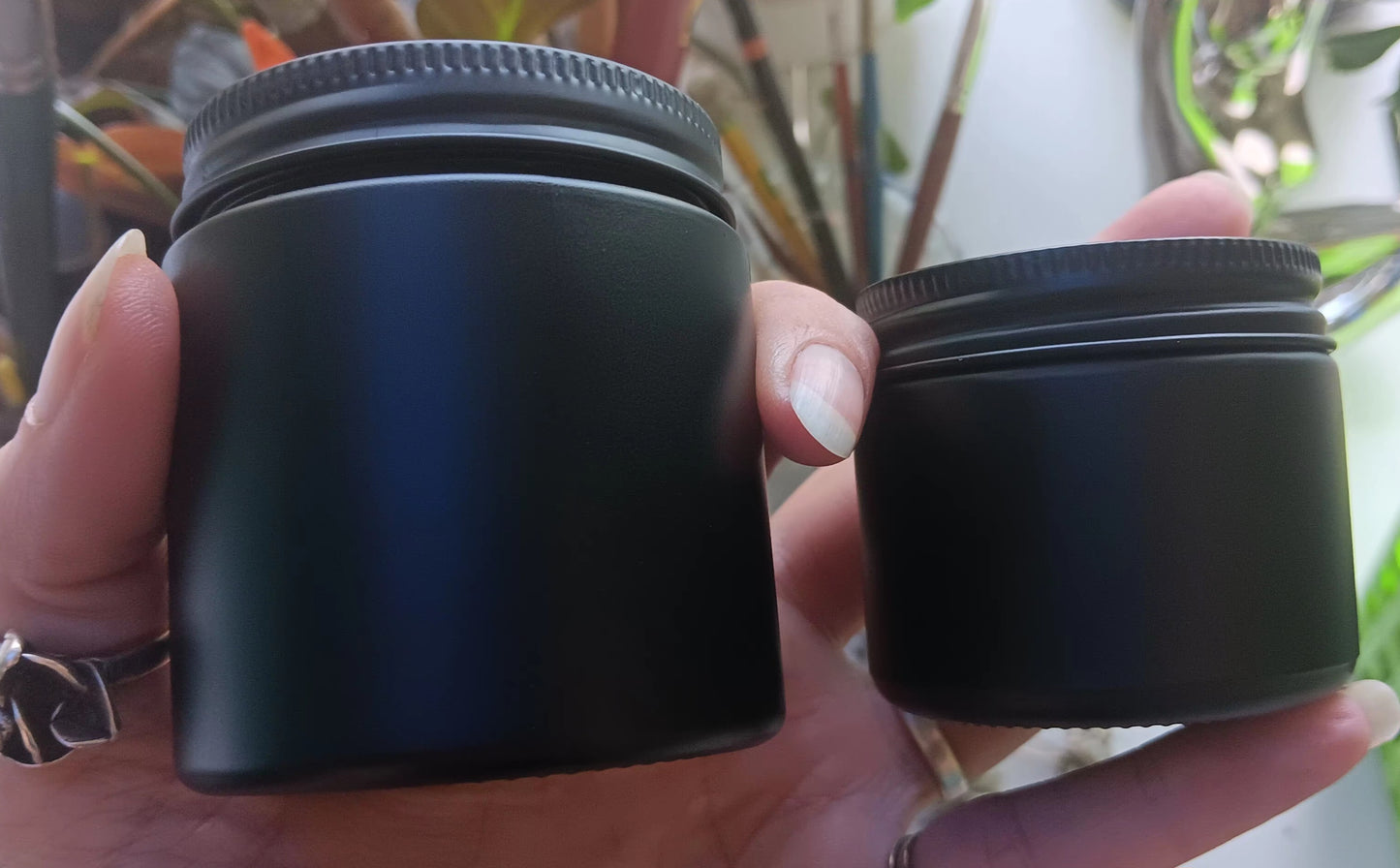 4oz and 2oz glass jar with tin tops.